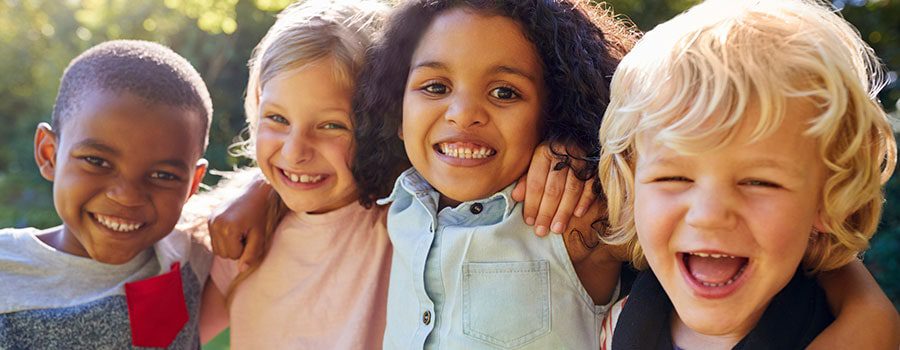 children with special needs embrace and smile