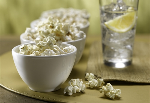 Popcorn in bowls beside water