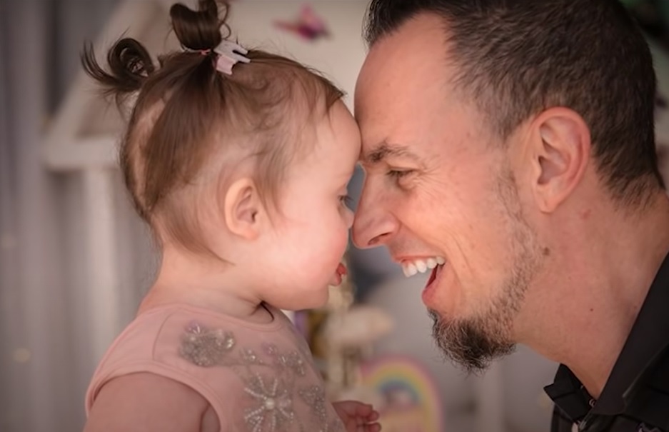 Stella, who has Down syndrome, nuzzles her dad, rock musician Mark Tremonti