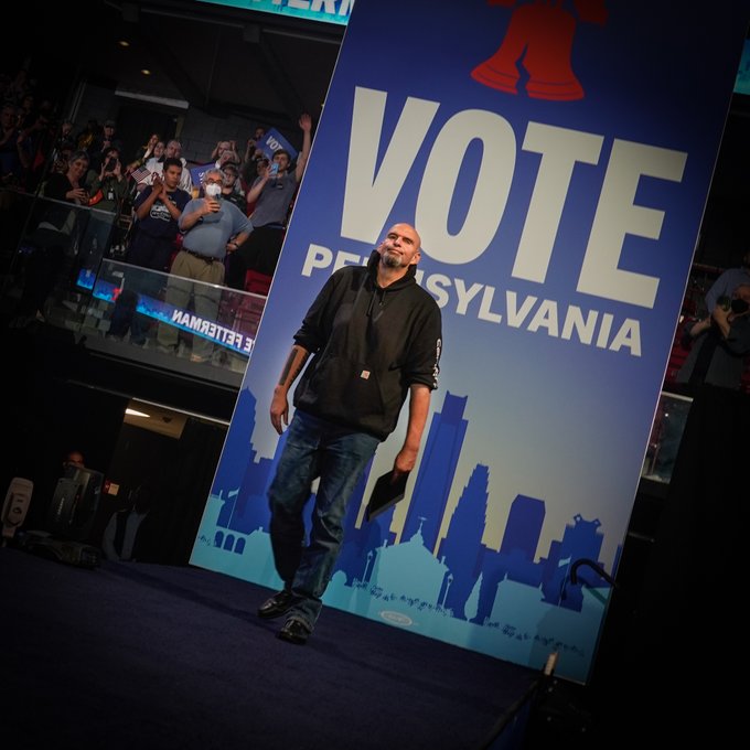 John Fetterman, on stage in front of Vote Pennsylvania signage
