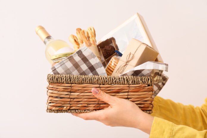 gift basket being held out by a women's hands