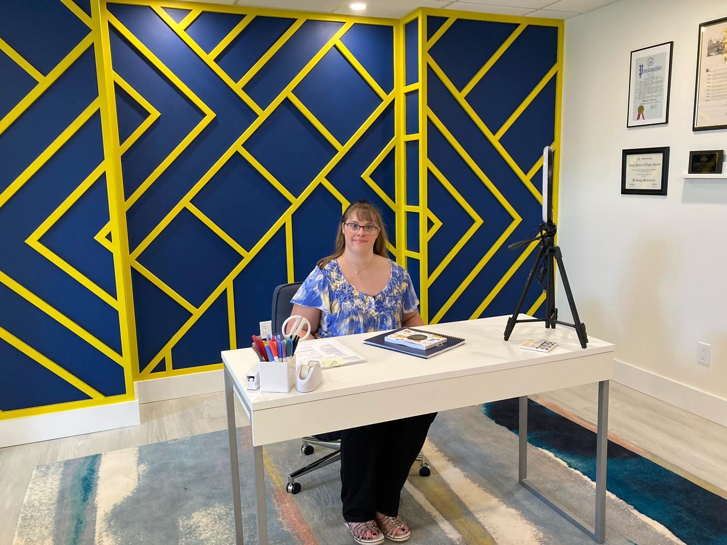 Brittany Schiavone sits at her desk