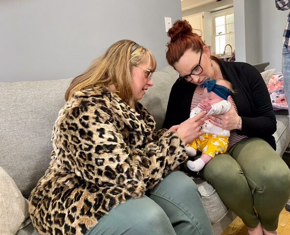 Brittany visits a family to deliver one of Brittany's Baskets of Hope