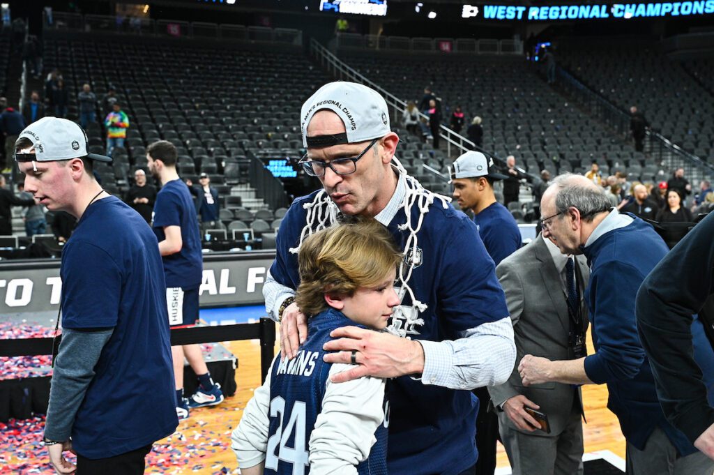 Rylan hugs players at March Madness
