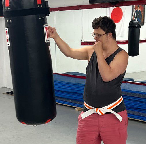 person with disabilities punches a punching bag