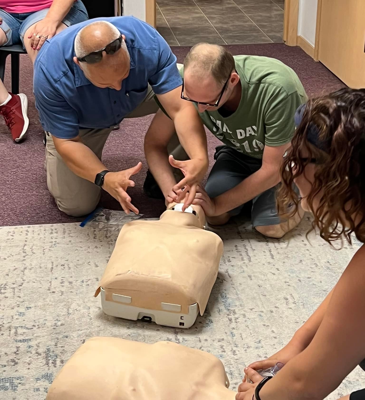 Participants with intellectual disabilities learn how to perform CPR. 